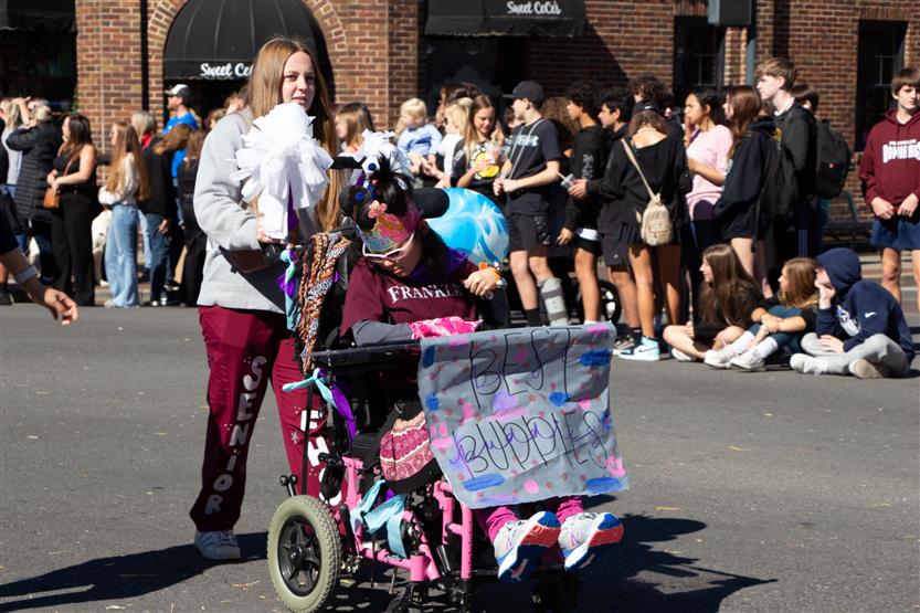 Students walk in the homecoming parade